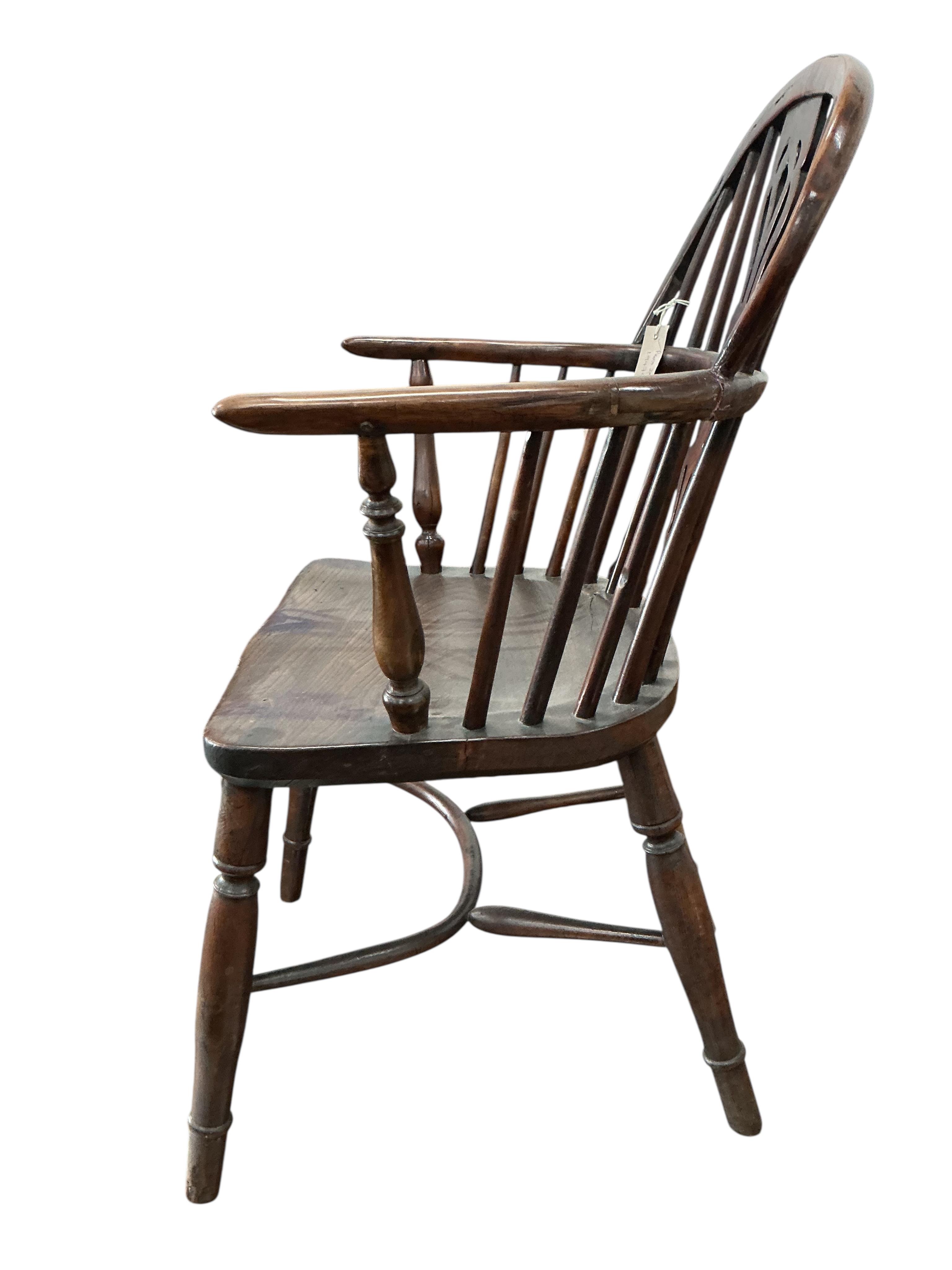 A mid 19th century yew, elm and ash Windsor chair, with pierced splat and crinoline stretcher, width 55cm, depth 40cm, height 88cm